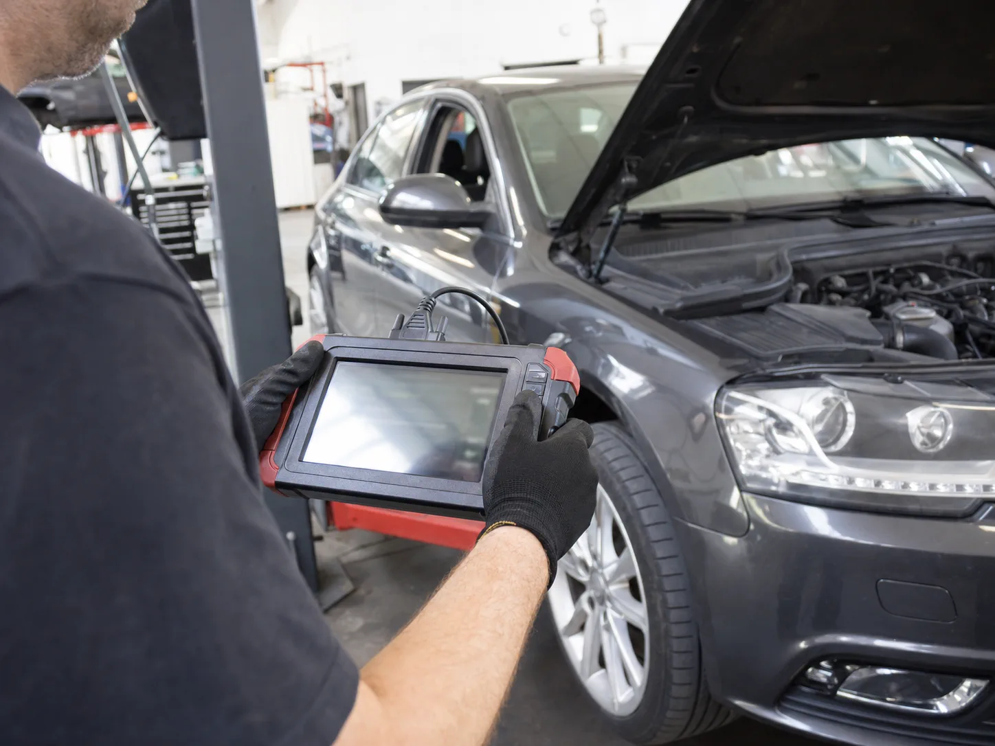 Technician reviewing European vehicle diagnostic information